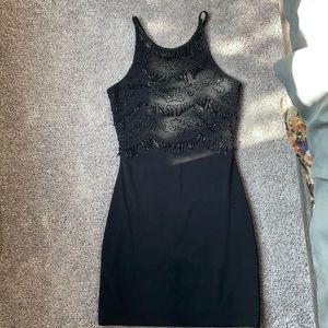 Black cocktail dress with crisscross back